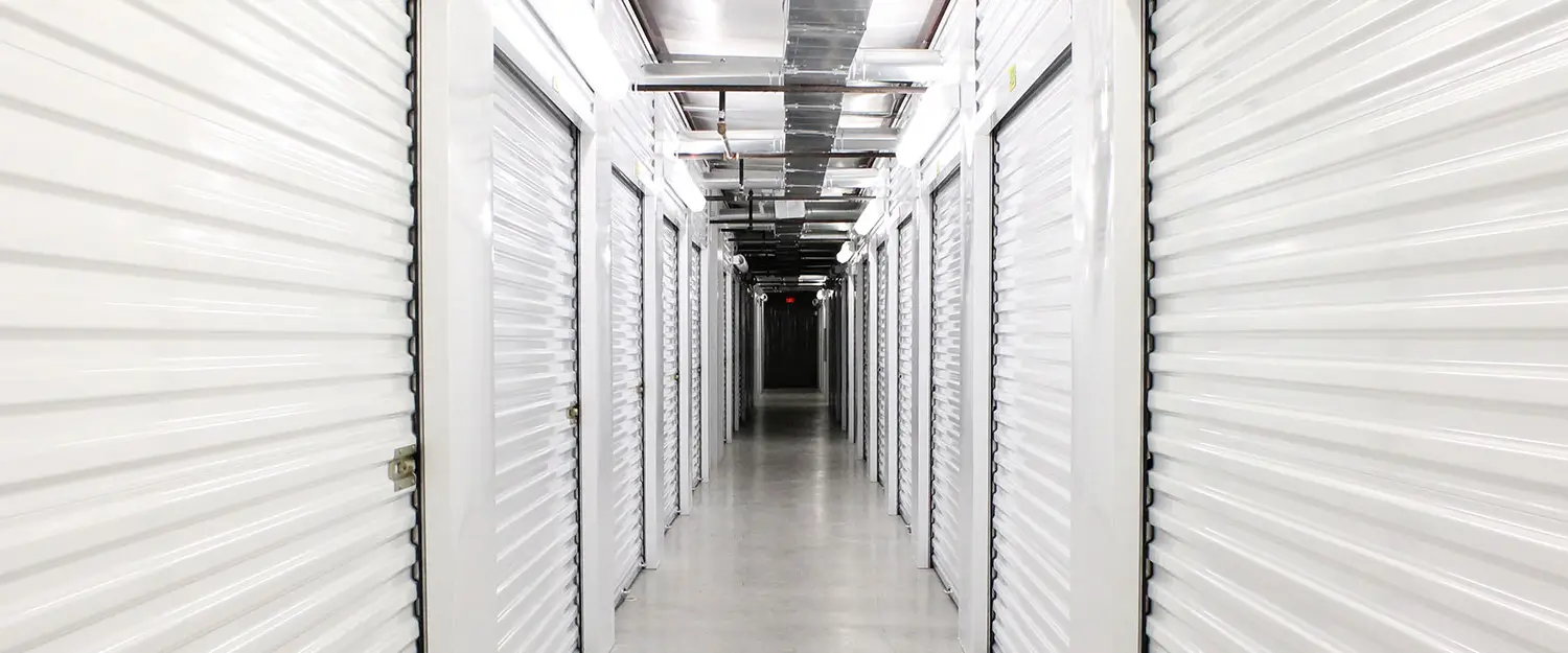 Indoor storage hallway with white doors